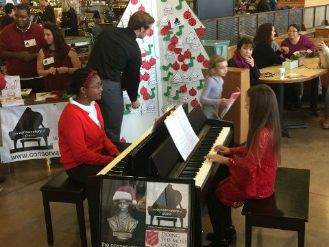 conservatory of piano booth at a christmas fair conservatory of piano booth at a christmas fair